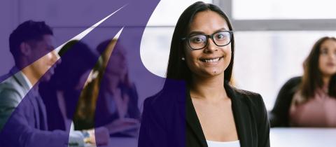 Young woman in black wearing glasses and smiling 